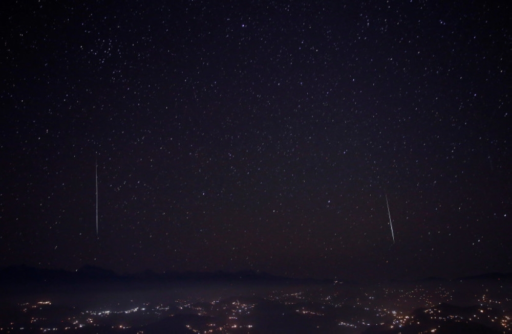 A Geminids meteor shower seen above the mountain range in Nagarkot, Nepal in 2017. — Reuters pic