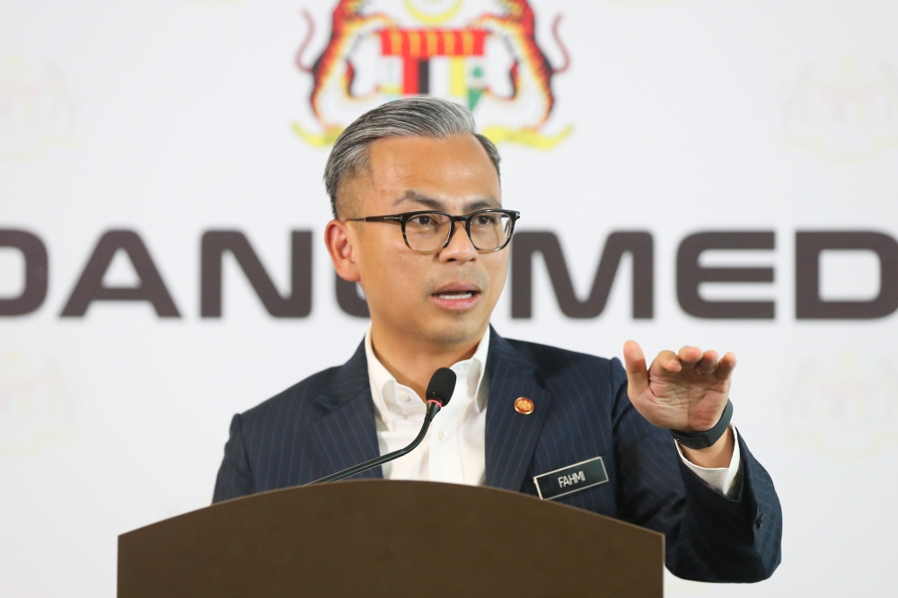 Communications Minister Fahmi Fadzil speaks during a post-Cabinet meeting press conference in Putrajaya on February 21, 2024. He said the meeting will discuss policy matters on the setting up of the zone. — Picture by Miera Zulyana