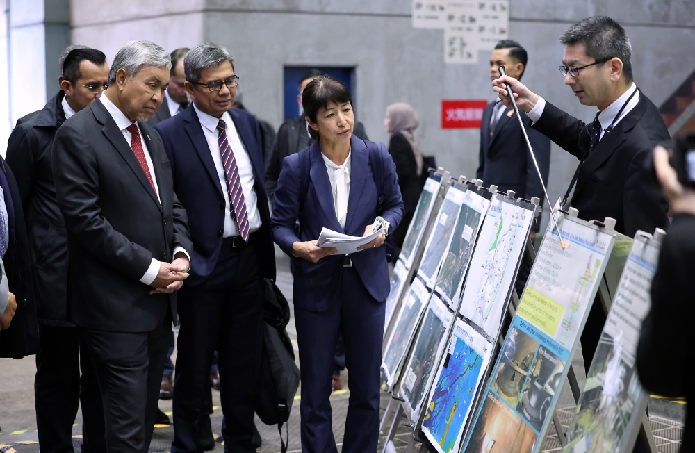 Deputy Prime Minister Datuk Seri Ahmad Zahid Hamidi hears a briefing on disaster management during a working visit to the Disaster Action Office of Kinki Regional Development Bureau, Ministry of Land, Infrastructure, Transport and Tourism in Osaka, February 21, 2024. — Bernama pic 