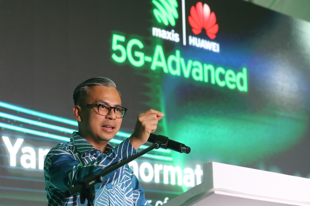 Communications Minister Fahmi Fadzil speaks during the Maxis 5G Advanced Trial Showcase at the KLCC Esplanade in Kuala Lumpur February 22, 2024. — Picture by Yusof Mat Isa