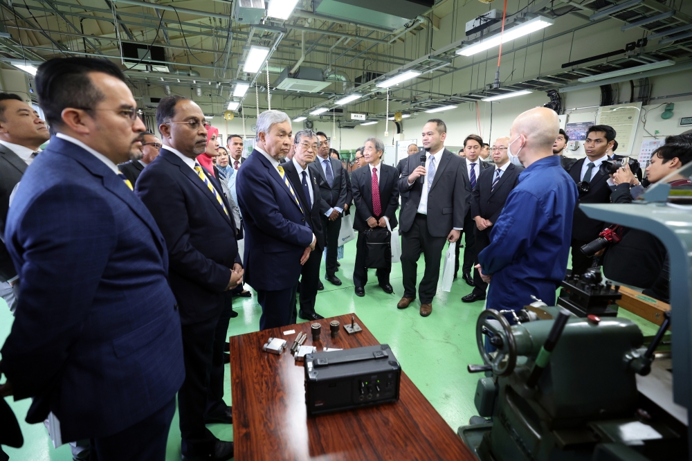 Deputy Prime Minister Datuk Seri Ahmad Zahid Hamidi during his visit to the National Institute of Technology, Tokyo College (Tokyo Kosen) on February 19, 2024. With him is Minister of Higher Education, Datuk Seri Zambry Abd Kadir (2nd, left). — Bernama pic 