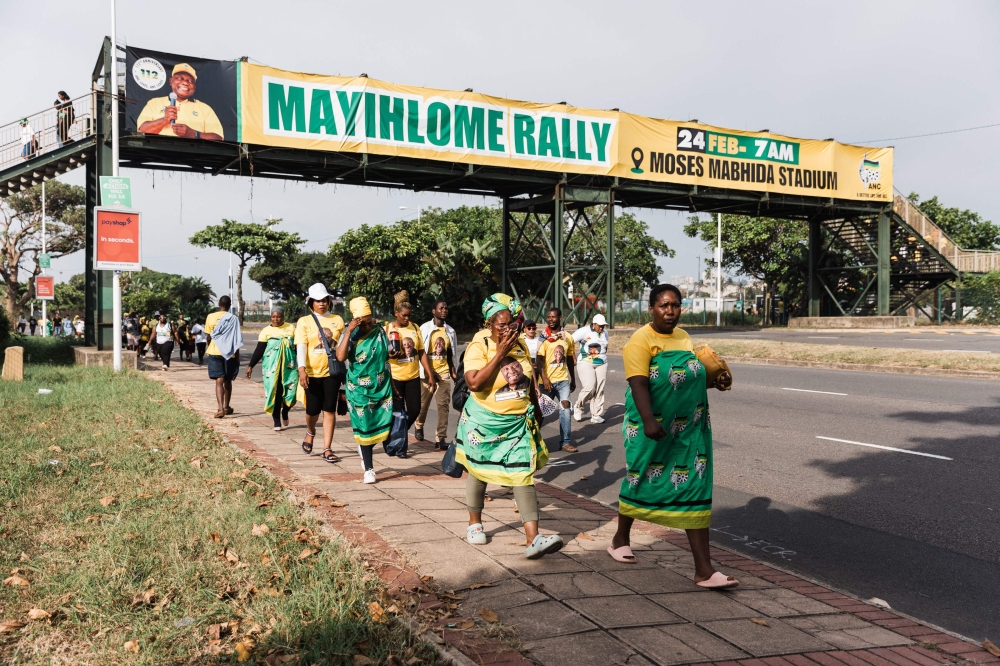 Supporters of the African National Congress (ANC) walk towards the Moses Mabhida Stadium for the Election Manifesto launch in Durban on February 24, 2024. — AFP pic