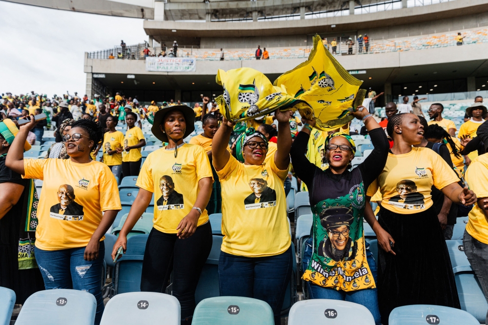 Supporters wearing t-shirts depicting South African President Cyril Ramaphosa, sing and dance at the African National Congress (ANC) Election Manifesto launch at the Moses Mabhida Stadium in Durban on February 24, 2024. — AFP pic