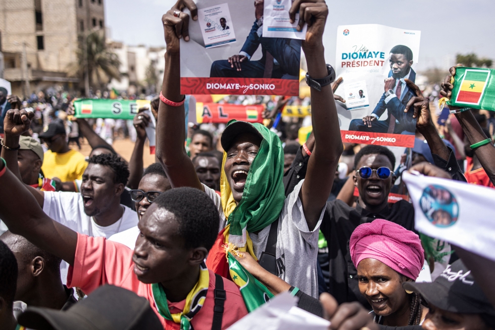 Opposition supporters chant during a demonstration in Dakar on February 24, 2024. Dakar residents are called to demonstrate on Saturday, either to put pressure on the head of state and get him to organize the presidential election before the official expiration of his mandate on April 2, or to support him. — AFP pic