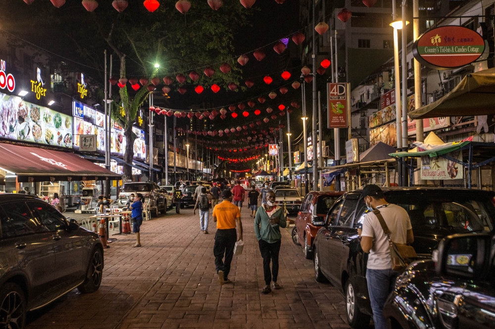 As the sun begins to set, Jalan Alor, once dubbed the ‘Red Light District’, begins to change its face and aura as it is filled with tourists from both within and outside the country who flood the street every day. — Picture by Firdaus Latif