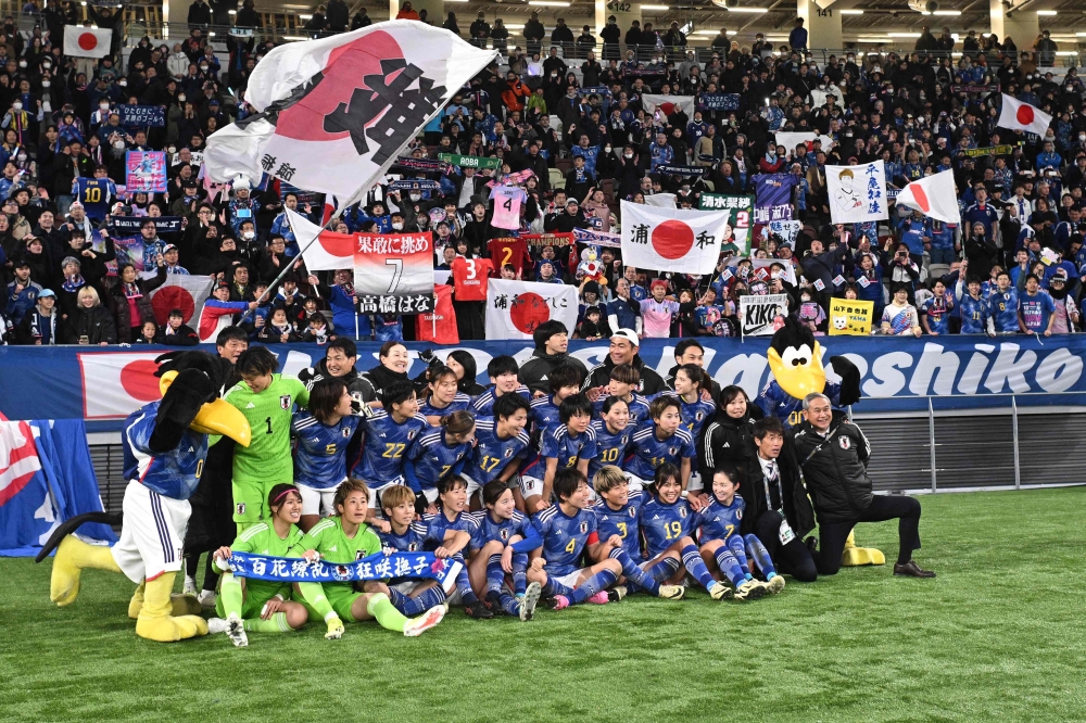 Japan's players celebrate their 2-1 victory after the 2024 Olympic qualifying women's football match between Japan and North Korea at the National Stadium in Tokyo February 28, 2024. — AFP pic 