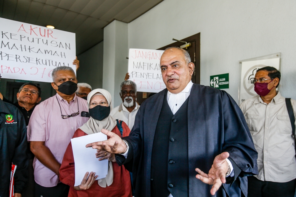 Lawyer Datuk Baljit Singh Sidhu (centre) speaks to reporters outside the courtroom at the Kuala Lumpur High Court Complex February 29, 2024. ― Picture by Hari Anggara