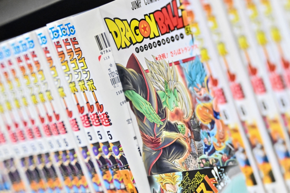 This photo illustration shows books from the popular ‘Dragon Ball’ manga series on a shelf in a store in downtown Tokyo on March 8, 2024. — AFP pic