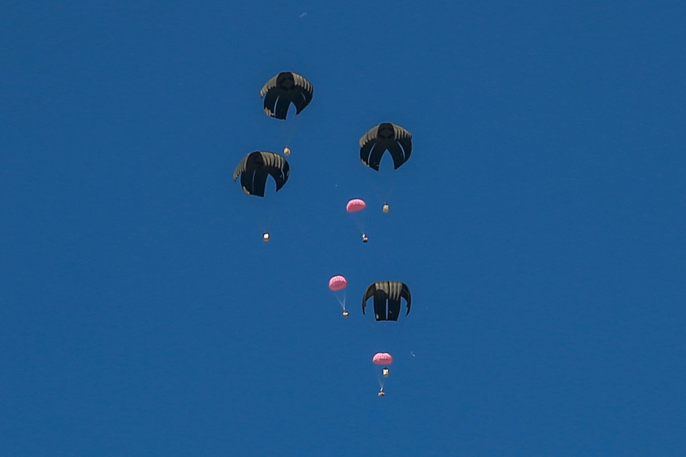 Pink aid parcels, reportedly to mark International Women’s Day, are airdropped over the northern Gaza Strip on March 8, 2024, amid the ongoing conflict between Israel and the Hamas movement. — AFP pic