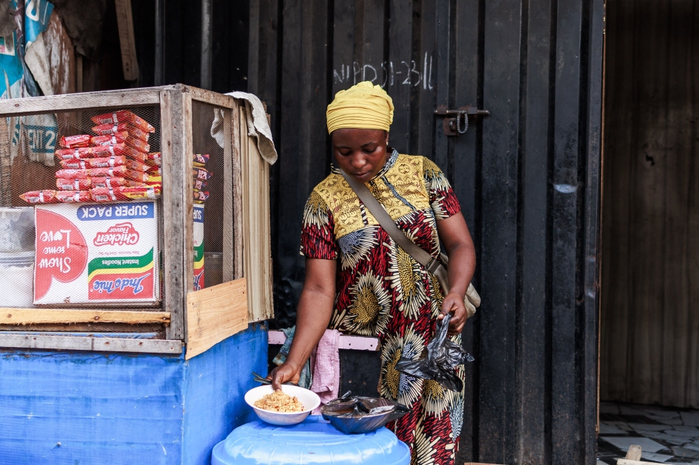 A chef prepares noodles for her customer at the Lagos island market in Lagos on March 8, 2024, ahead of the holy fasting month of Ramadan. — AFP pic