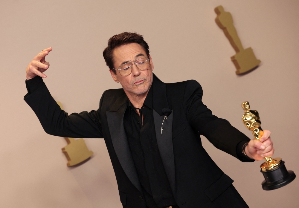 In supporting actor categories, Robert Downey Jr. poses with the Best Supporting Actor Oscar for ‘Oppenheimer’. — Reuters pic