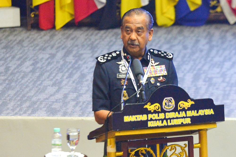 Inspector-General of Police Tan Sri Razarudin Husain delivers his speech during the PDRM special dialogue 2024 at PDRM College in Kuala Lumpur, March 11, 2024. — Picture by Shafwan Zaidon