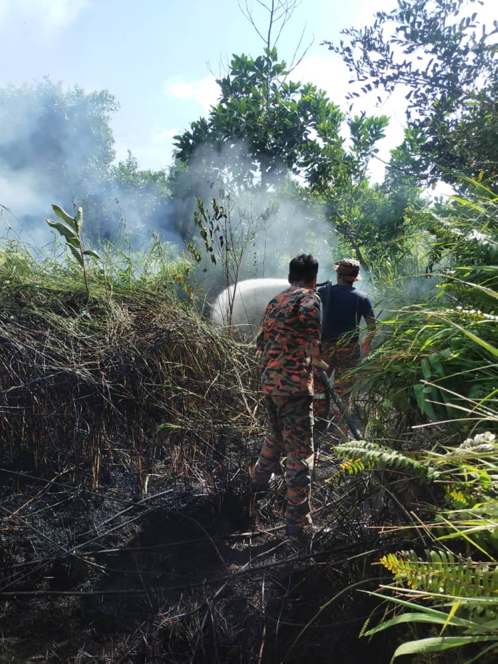 Photo shows the thick smoke in Kuala Baram during the bushfire that affected 75ha of land. — Picture courtesy of Fire and Rescue Department of Malaysia