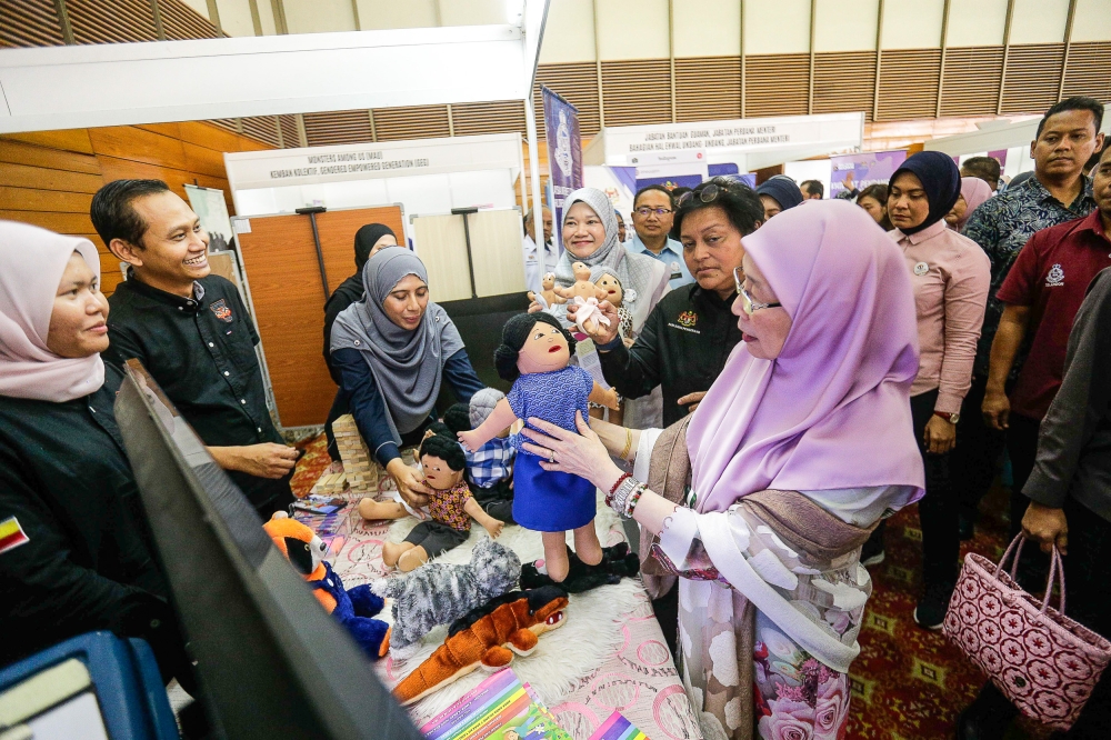 Bandar Tun Razak MP Datuk Seri Dr Wan Azizah Wan Ismail along with Minister in the Prime Minister’s Department (Law and Institution Reformation) Datuk Seri Azalina Othman Said and Education Minister Fadhlina Sidek visit a booth during the launch of the Convention to Protect Students from Sexual Exploitation at the Silver Jubilee Hall, SUK Selangor March 16, 2024. — Picture by Sayuti Zainudin