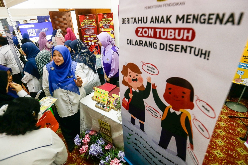 Participants visit booths during the launch of the Convention to Protect Students from Sexual Exploitation at the Silver Jubilee Hall, SUK Selangor March 16, 2024. — Picture by Sayuti Zainudin