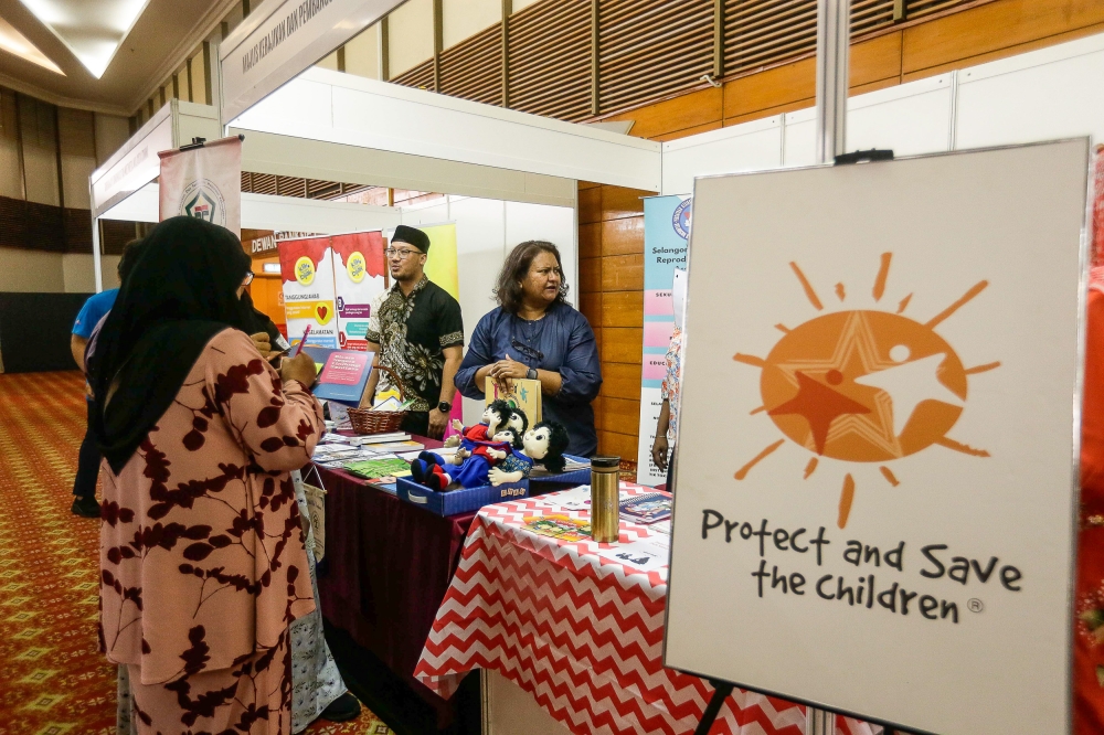 Participants visit booths during the launch of the Convention to Protect Students from Sexual Exploitation at the Silver Jubilee Hall, SUK Selangor March 16, 2024. — Picture by Sayuti Zainudin