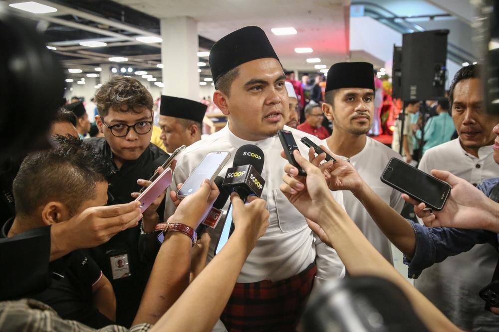 Umno Youth chief Dr Muhammad Akmal Saleh speaks to reporters during Umno’s breaking of fast event in Kuala Lumpur March 22, 2024. — Picture by Yusof Mat Isa  