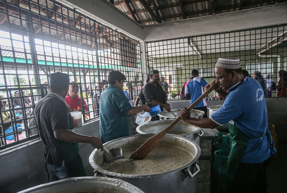 Masjid India Muslim Ipoh, located in Jalan Seenivasagam, continue its annual tradition of preparing bubur lambuk throughout the month of Ramadan to be distributed to the public as an iftar meal. — Picture by Farhan Najib