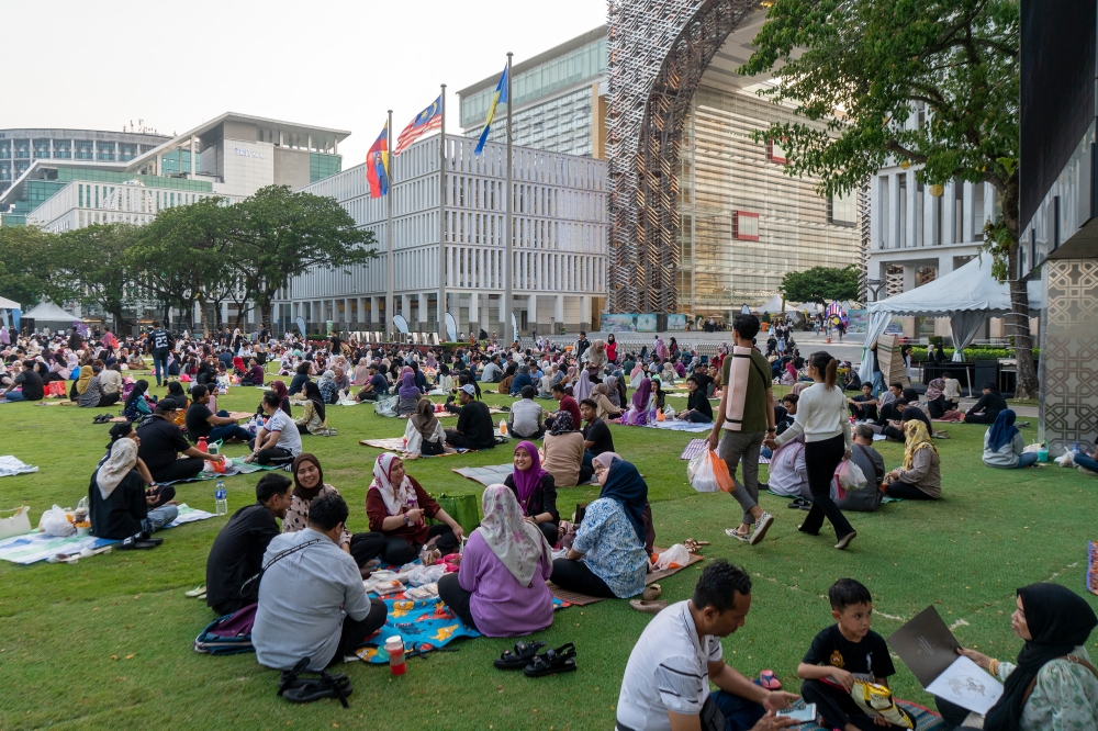 People break their fast at Perbadanan Putrajaya during the holy month of Ramadan in Putrajaya March 19, 2024. — Picture by Shafwan Zaidon