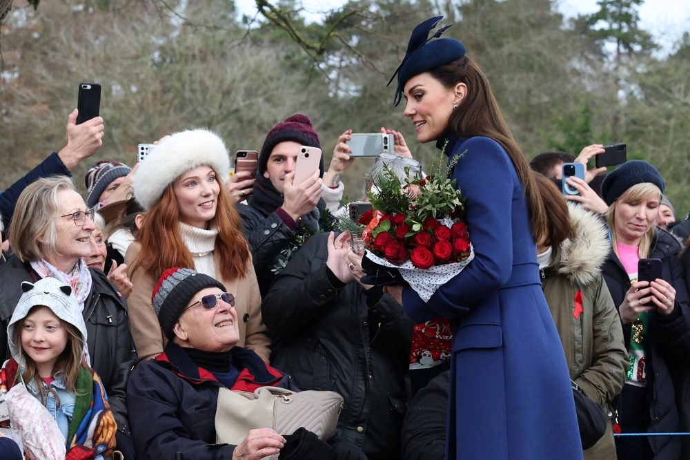 Britain's Catherine, Princess of Wales (right) chats with well-wishers after attending the Royal Family's traditional Christmas Day service at St Mary Magdalene Church on the Sandringham Estate December 25, 2023. — AFP pic 