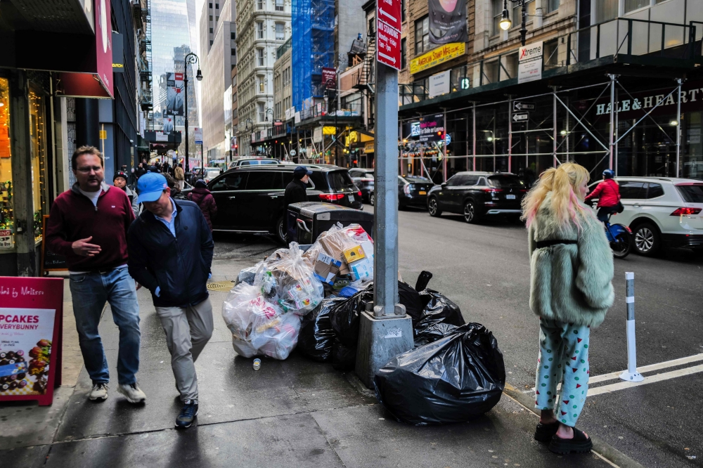 Mountains of black garbage bags line cramped city sidewalks, a feast for the millions of rodents who call New York home. — AFP pic