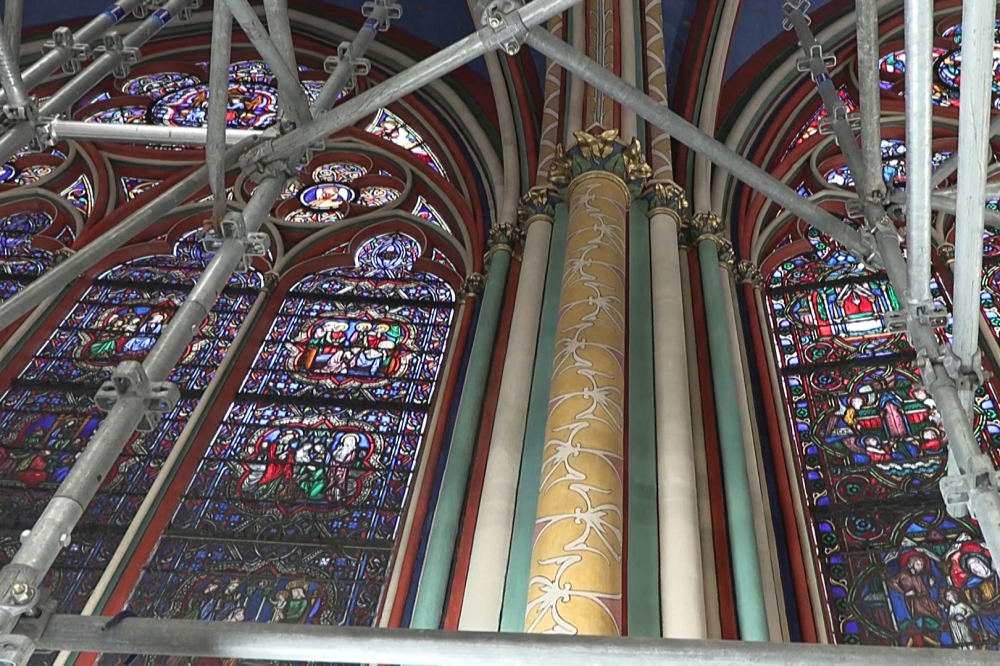 This video grab created from an AFP video taken on April 11, 2024, shows stained-glass windows inside Paris Notre-Dame cathedral currently under restoration. — AFP pic