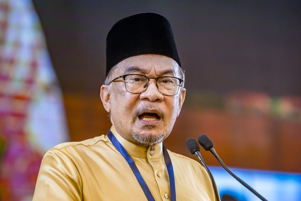 Prime Minister Datuk Seri Anwar Ibrahim speaks at PKR's 25th Anniversary Special Convention at IDCC Shah Alam April 21, 2024. — Picture by Firdaus Latif