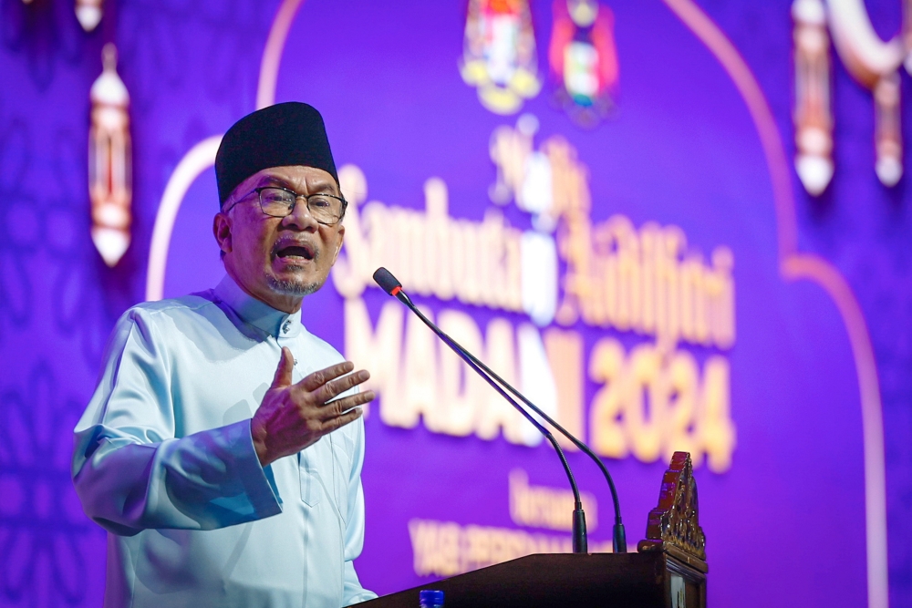 Prime Minister Datuk Seri Anwar Ibrahim addressing the Melaka state-level Aidilfitri Madani 2024 celebration at the Melaka International Trade Centre (MITC) in Ayer Keroh, April 22, 2024. — Bernama pic 