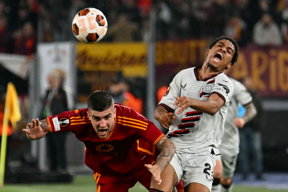 Bayer Leverkusen’s French forward Amine Adli (right) fights for the ball with Roma’s Italian defender  Gianluca Mancini during the Uefa Europa League semi final first leg football match between AS Roma and Bayern Leverkusen at the Olympic stadium on May 2, 2024 in Rome. — AFP pic