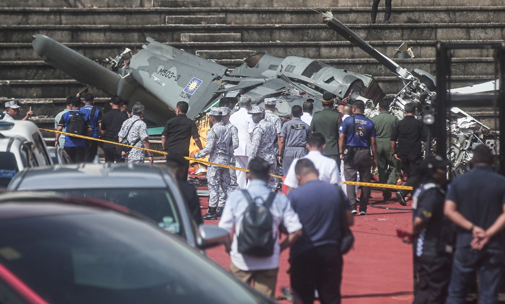 One of the helicopters that crashed at TLDM stadium during training for a flyover for the 90th Navy Day celebration at the RMN base in Lumut. All 10 personnel on board were killed after a Maritime Operations Helicopter (HOM-AW139) and a Fennec helicopter crashed at 9.32am, April 23, 2024. — Picture by Farhan Najib