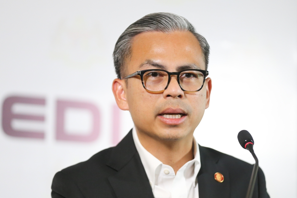 Communication Minister Fahmi Fadzil speaks during a press conference in Putrajaya May 8, 2024. — Picture by Miera Zulyana