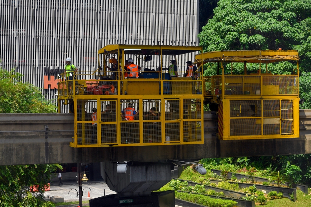 Detailed cleaning and repair work is being carried out by Rapid Rail with the help of Kuala Lumpur City Hall following the incident of a fallen tree affecting the monorail route at Jalan Sultan Ismail, May 8, 2024. — Bernama pic 