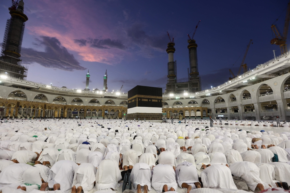 Muslim pilgrims perform prayers around the Kaaba, Islam’s holy shrine, at the Grand Mosque in the Saudi holy city of Mecca ahead of the Haj pilgrimage in this file picture dated June 19, 2023. The first group of 282 Malaysian pilgrims will depart for the Holy Land early Thursday morning (May 9). — AFP pic 