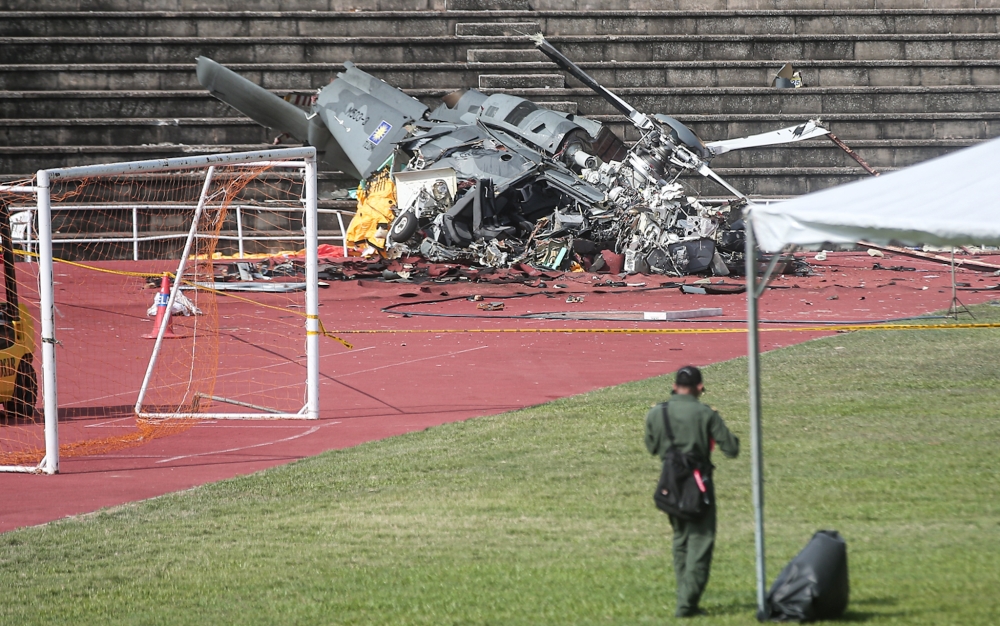 Picture shows the wreckage of one of the two helicopters that crashed at TLDM stadium, April 3, 2024, during training for a flyover for the 90th Navy Day celebration. — Picture by Farhan Najib