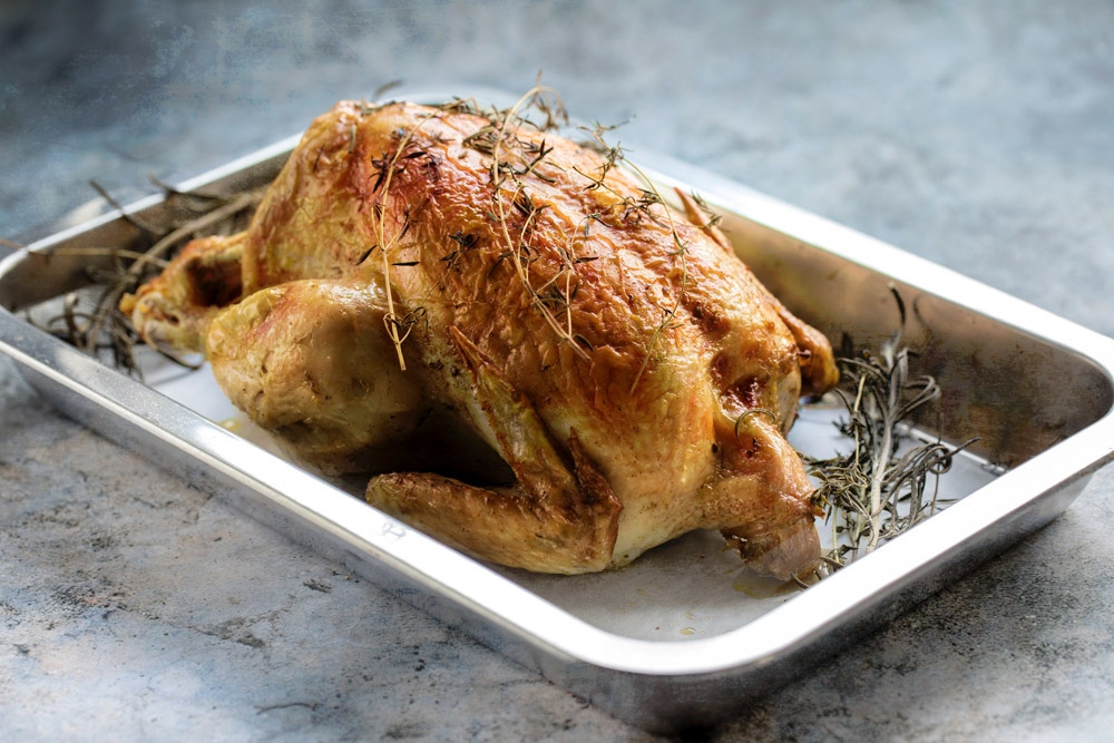 Allow the roast chicken to rest before slicing.