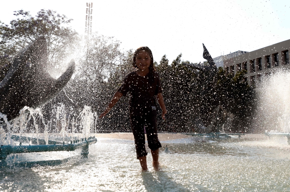 A youngster enjoys a fountain during a heat wave hitting the country, in Guadalajara, Jalisco state, Mexico, on May 9, 2024. — ETX-Relaxnews pic