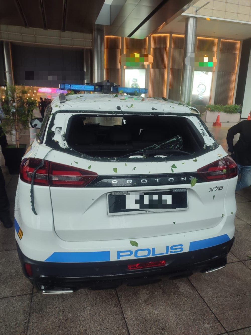 A damaged police vehicle when a tree fell during this afternoon’s downpour along Jalan Pinang. According to Kuala Lumpur police chief Datuk Rusdi Mohd Isa, the damaged car was part of the Melaka chief minister’s convoy. — Picture courtesy of PDRM