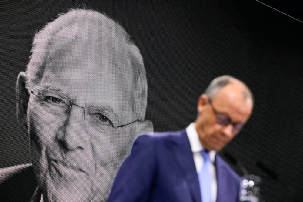 A portrait of the late German politician Wolfgang Schaeuble is seen on a screen as the leader of Germany's conservative Christian Democratic Union (CDU) party Friedrich Merz speaks at Estrel Berlin Hotel in Berlin, May 6, 2024. A hole was discovered on Wolfgang Schaeuble’s grave and its appearance is currently being investigated. — AFP pic