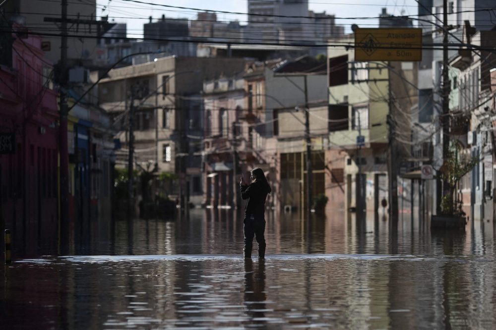 View of a flooded street in the Cidade Baixa neighbourhood of Porto Alegre. — AFP pic