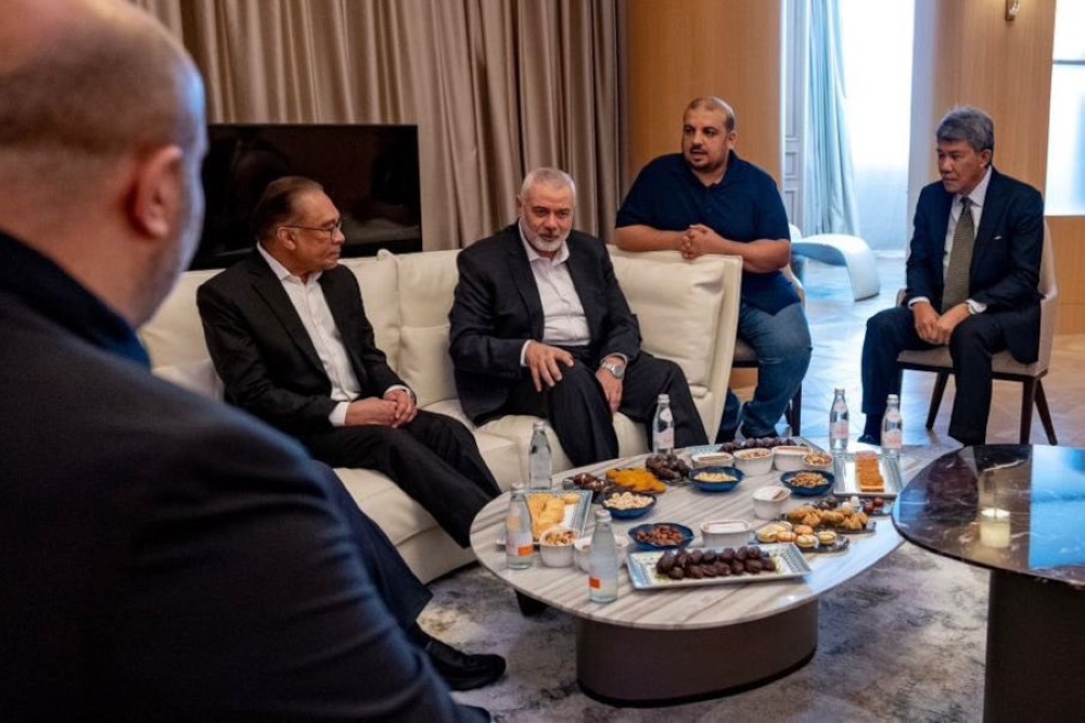 File picture of Prime Minister Datuk Seri Anwar Ibrahim meeting with Hamas’ top political leader, Ismail Haniyeh, at a hotel in Doha, May 14, 2024. — Picture from Twitter/Anwar Ibrahim 