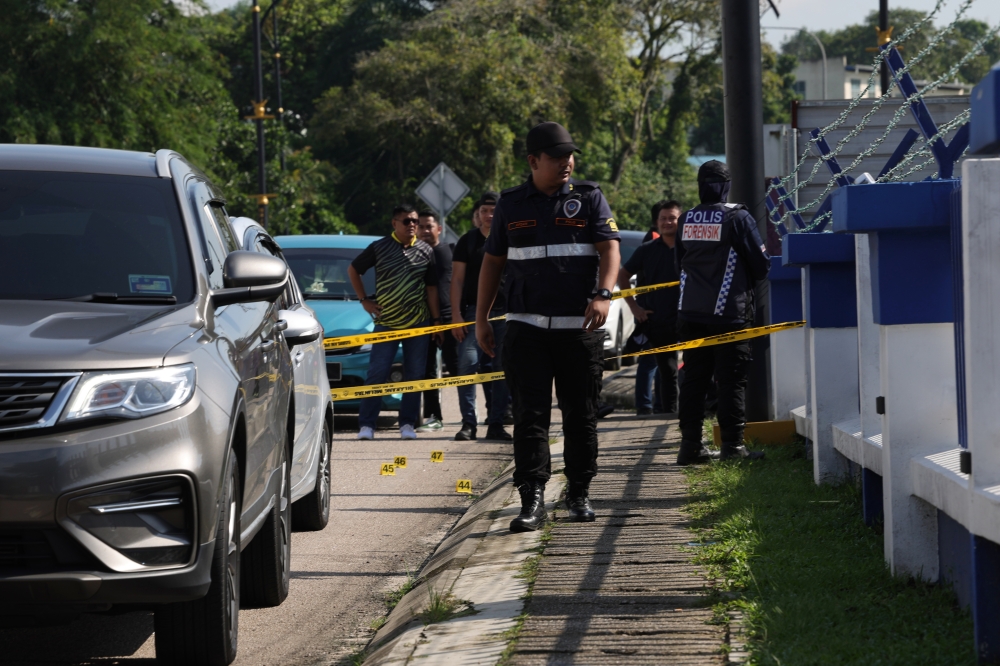 Forensic police examine the scene of the attack at the Ulu Tiram police station, Johor Baru, May 17, 2024. ― Bernama pic 