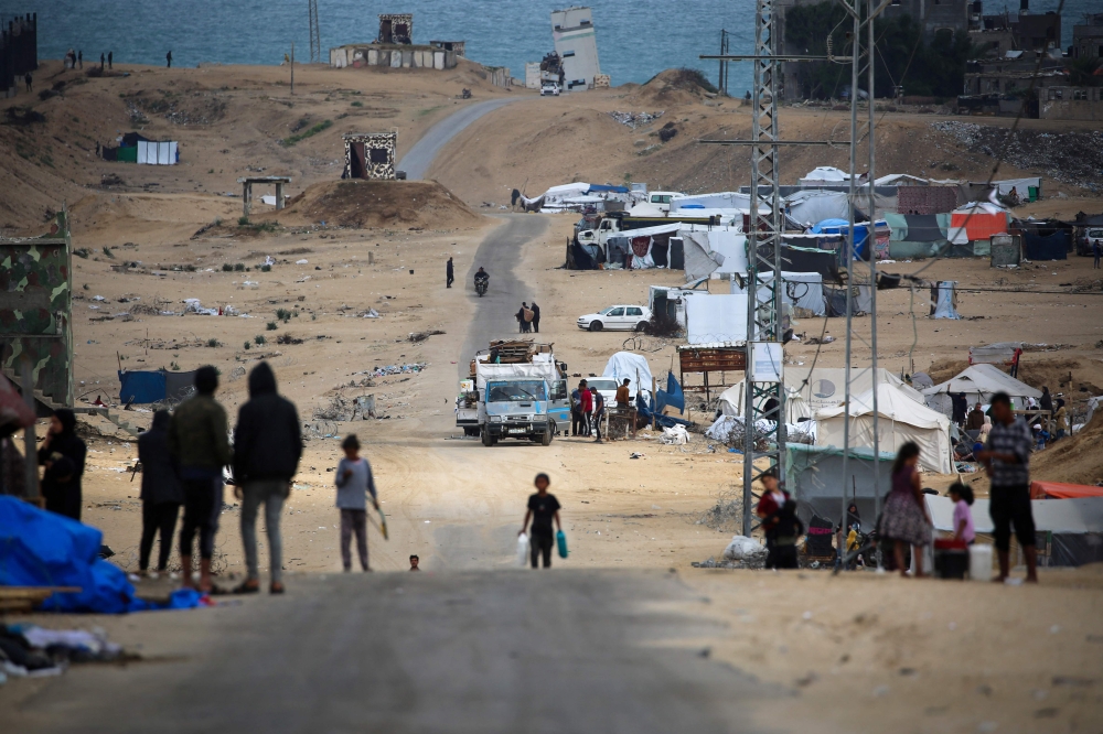 Palestinian pack their belongings as they prepare to flee Rafah in the southern Gaza Strip on May 13, 2024, amid the ongoing conflict between Israel and Hamas. — AFP pic