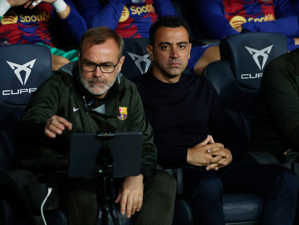 FC Barcelona coach Xavi and assistant coach Oscar Hernandez before the match against Real Sociedad at Estadi Olimpic Lluis Companys, Barcelona, May 13, 2024. — Reuters pic 