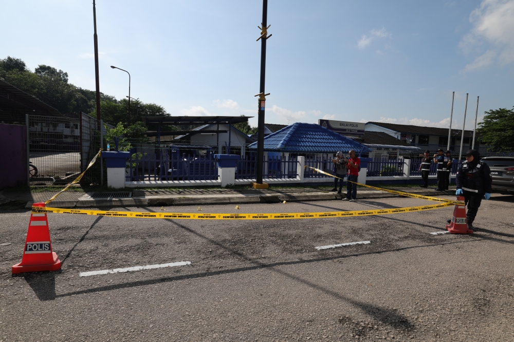 In the 2.45am ambush on the police station, three people were confirmed dead, two constables aged 22 and the 21-year-old attacker who was gunned down, while another policeman suffered injuries. — Bernama pic       