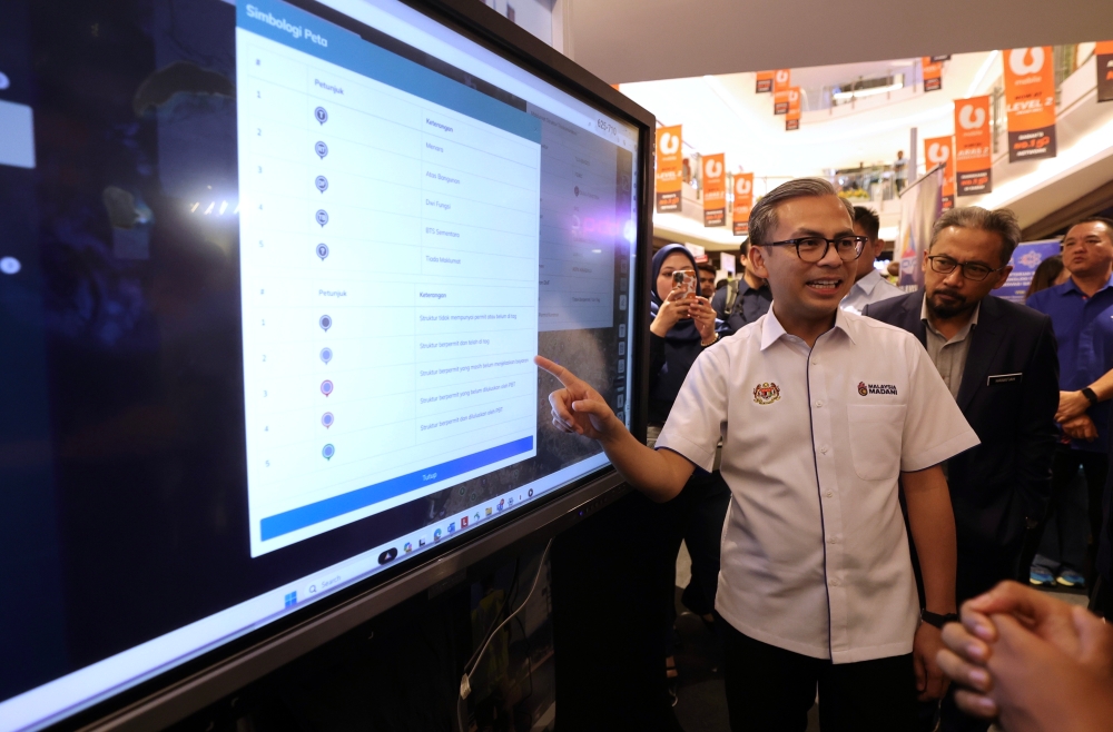 Communications Minister Fahmi Fadzil looks at areas throughout the state of Sabah where telecommunications substations have been installed, Kota Kinabalu, May 17, 2024. — Bernama pic 