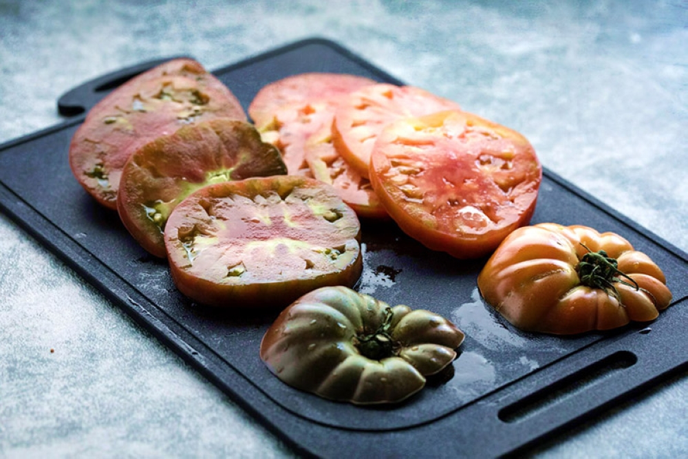 Thickly sliced heirloom beefsteak tomatoes.