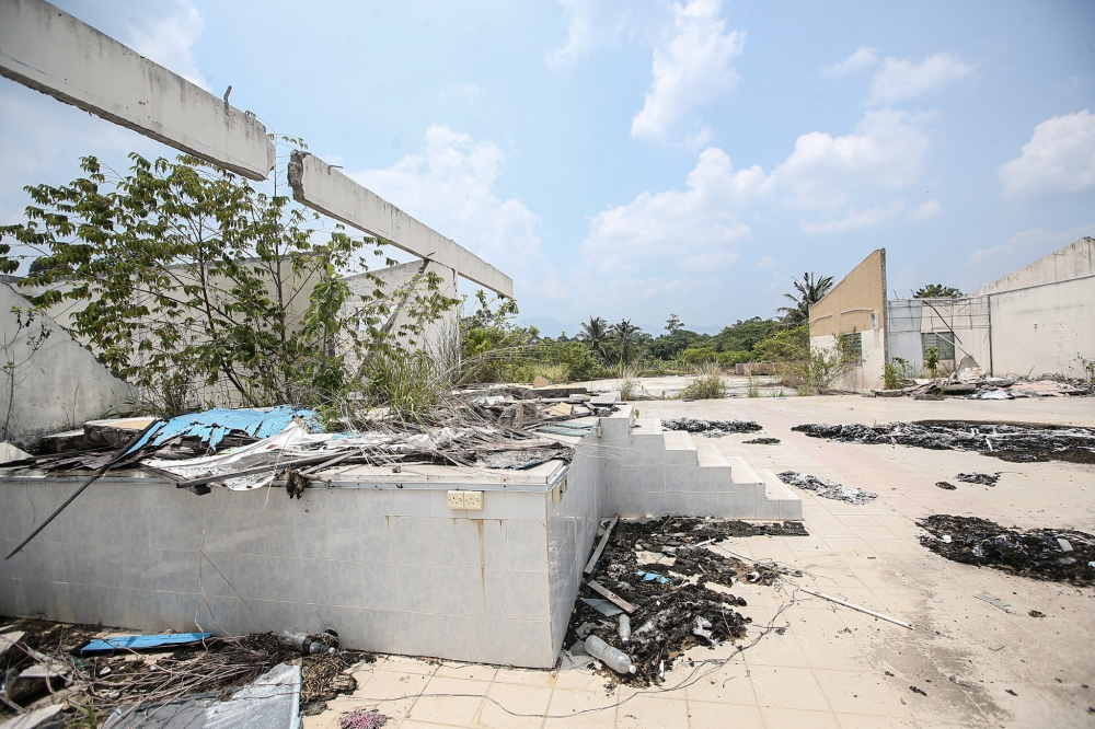 The buildings at the former Bukit Desa Rimba National Service camp in Sauk, Kuala Kangsar were left to ruin and abandoned after the programme was halted back in 2018. Picture taken on May 2, 2024. — Picture by Farhan Najib
