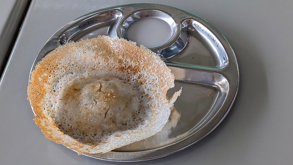 A sweet 'appam' with brown sugar and coconut milk is a great way to end your meal.