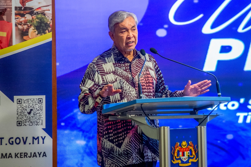 Deputy Prime Minister Datuk Seri Ahmad Zahid Hamidi delivers his speech during the launch of UP_TVET system in Putrajaya May 20, 2024. — Picture by Shafwan Zaidon