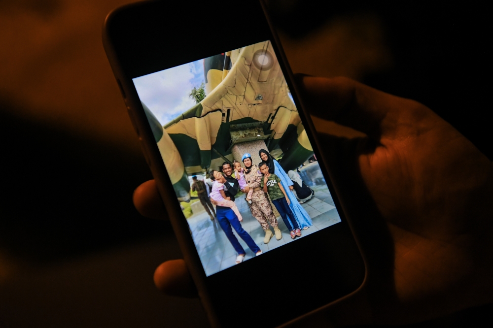 Noor Azmi Ariffin, 39, husband of the late Sergeant Faridah Abd Rahman, a senior non-commissioned officer from the Malaysian Battalion 850-11 (MALBATT 850-11), shows a picture of his late wife who passed away in Lebanon, when met at his home in Kampung Sungai Mati, Pendang, Kedah, May 19, 2024. — Bernama pic 